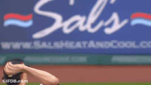 A Baseball Player Throws A Ball In Front Of A Cool.com Sign GIF