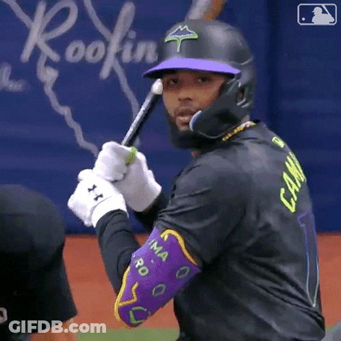 A Baseball Player Wearing A Black Jersey With The Number 1 On It GIF