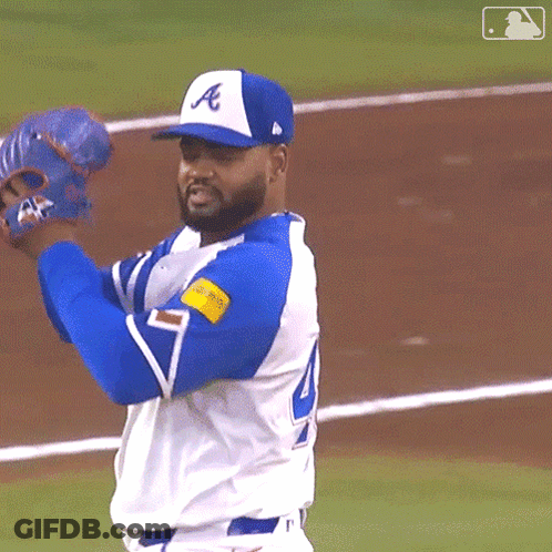 A Baseball Player Wearing A Blue And White Uniform With The Letter A On It GIF