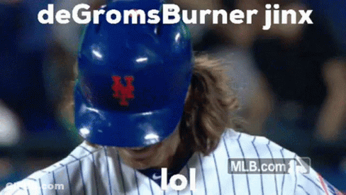 A Baseball Player Wearing A Blue Helmet With The Letter N On The Front GIF
