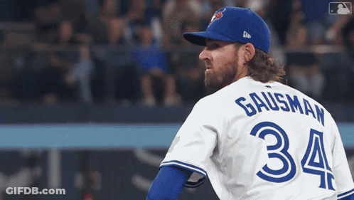 A Baseball Player Wearing A Blue Jays Uniform With The Number 34 On The Back GIF