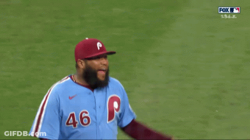A Baseball Player Wearing A Blue Jersey With The Number 46 GIF