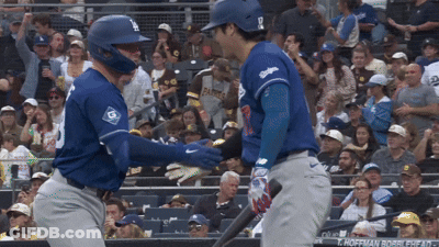 A Baseball Player Wearing A Blue Jersey With The Number 9 On It GIF