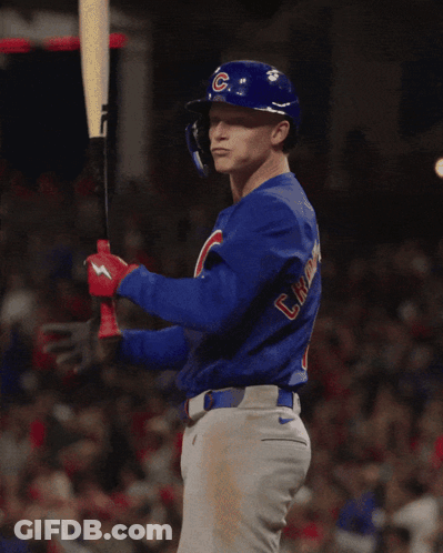 A Baseball Player Wearing A Blue Shirt That Says Cubs On It GIF