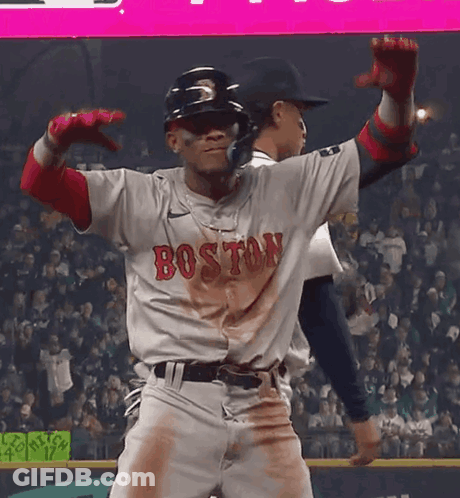 A Baseball Player Wearing A Boston Jersey Is Dancing GIF