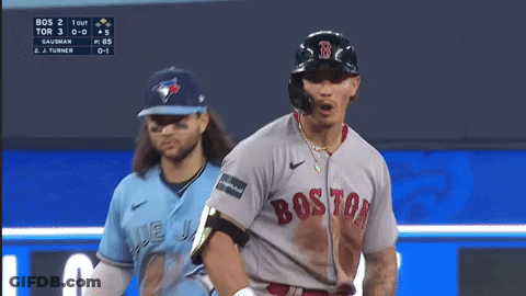 A Baseball Player Wearing A Boston Jersey Is Looking Down GIF