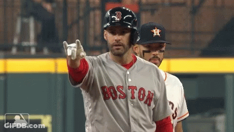 A Baseball Player Wearing A Boston Jersey Points At The Camera GIF
