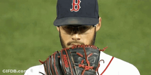 A Baseball Player Wearing A Boston Red Sox Hat And Sunglasses GIF