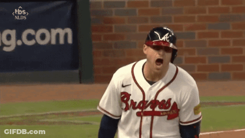 A Baseball Player Wearing A Braves Jersey Is Screaming GIF
