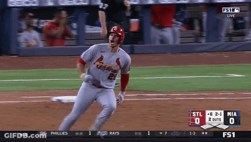 A Baseball Player Wearing A Cardinals Jersey Runs Towards Home Plate GIF
