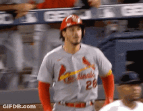A Baseball Player Wearing A Cardinals Jersey Stands On The Field GIF