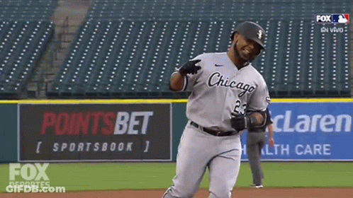 A Baseball Player Wearing A Chicago Uniform Is Running On The Field GIF