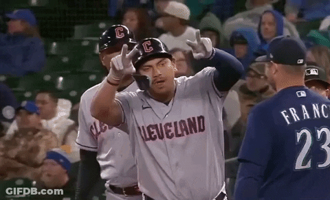 A Baseball Player Wearing A Cleveland Jersey Is Giving A Peace Sign GIF