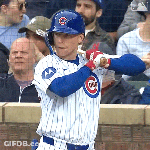A Baseball Player Wearing A Cubs Uniform Holds A Bat GIF