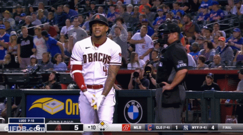 A Baseball Player Wearing A Dbacks Jersey Stands In Front Of A Crowd GIF