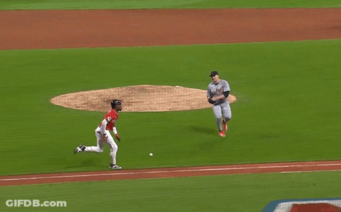 A Baseball Player Wearing A Detroit Jersey Is Sliding Into Second Base GIF