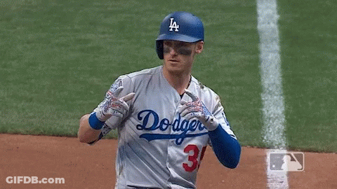 A Baseball Player Wearing A Dodgers Jersey And Number 31 Gloves GIF