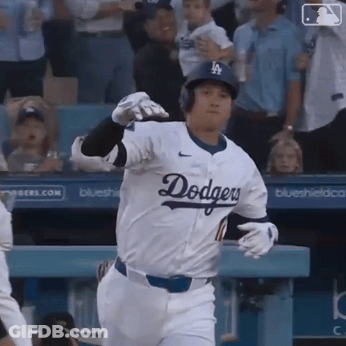 A Baseball Player Wearing A Dodgers Jersey Is Running Towards The Dugout GIF