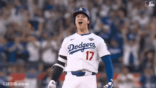 A Baseball Player Wearing A Dodgers Jersey Is Standing On The Field . GIF