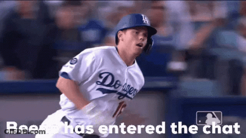 A Baseball Player Wearing A Dodgers Uniform Is Running Towards Home Plate GIF