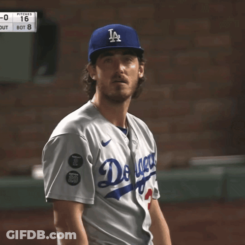 A Baseball Player Wearing A Dodgers Uniform Looks To His Left GIF