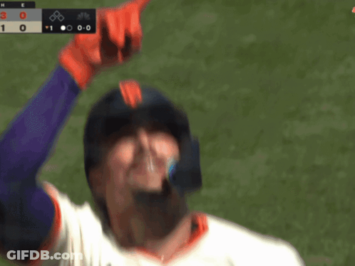 A Baseball Player Wearing A Giants Helmet Looks Up At The Scoreboard GIF