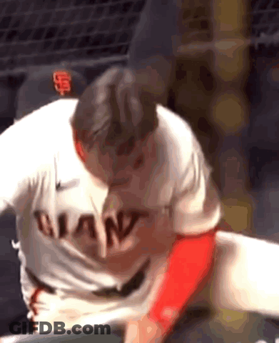 A Baseball Player Wearing A Giants Jersey Is Getting Ready To Throw The Ball . GIF