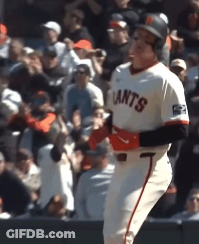 A Baseball Player Wearing A Giants Jersey Runs Towards The Crowd GIF
