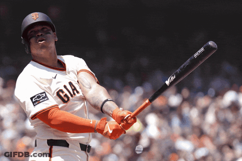 A Baseball Player Wearing A Giants Jersey Swings His Bat GIF
