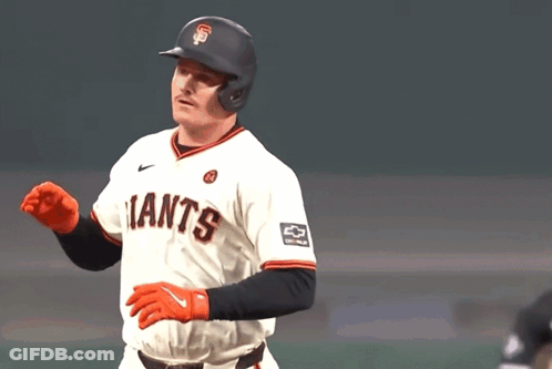 A Baseball Player Wearing A Giants Jersey Waves His Hand GIF