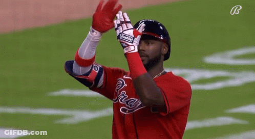 A Baseball Player Wearing A Glove That Says Rawlings GIF