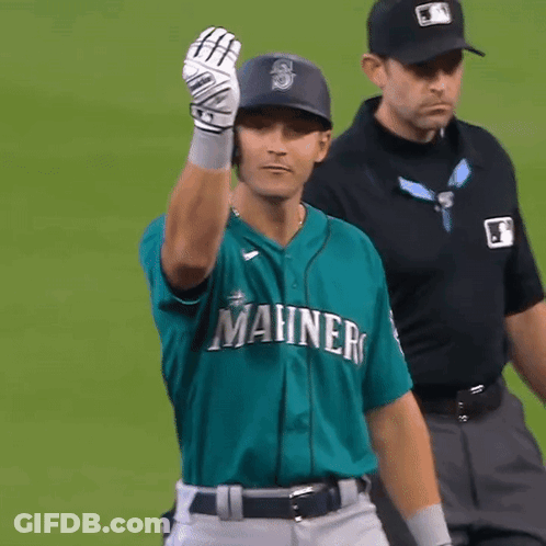A Baseball Player Wearing A Green Shirt That Says Manners GIF