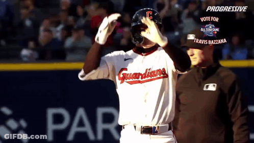 A Baseball Player Wearing A Guardians Uniform Stands On The Field GIF