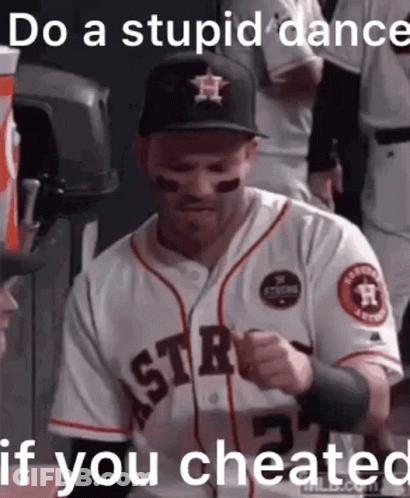 A Baseball Player Wearing A Hat And A Jersey With The Words `` Do A Stupid Dance If You Cheated '' Written On It . GIF