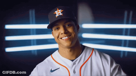 A Baseball Player Wearing A Hat With The Letter H On It Smiles GIF