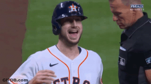 A Baseball Player Wearing A Helmet And A Jersey That Says Astros GIF