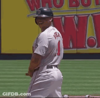 A Baseball Player Wearing A Helmet And A Jersey With The Number 1 On It Is Smiling . GIF