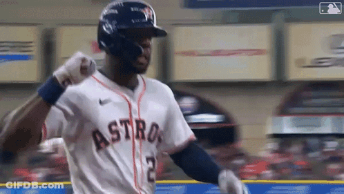 A Baseball Player Wearing A Helmet And A Jersey With The Word Astros On It Is Standing On The Field . GIF