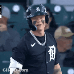 A Baseball Player Wearing A Helmet And A Tigers Jersey GIF