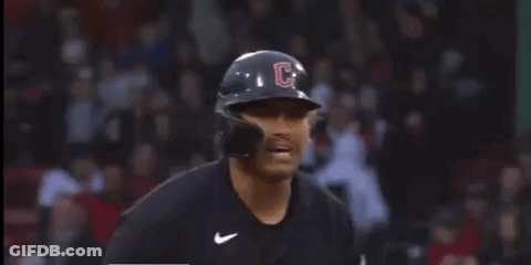 A Baseball Player Wearing A Helmet And Gloves With The Letter C On It . GIF