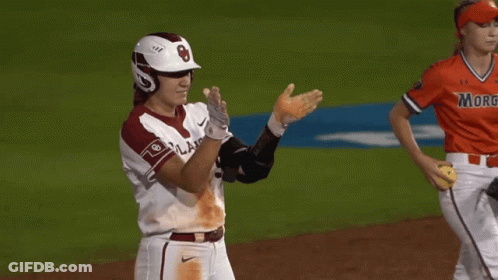 A Baseball Player Wearing A Helmet And Knee Pads With The Letter B On It GIF