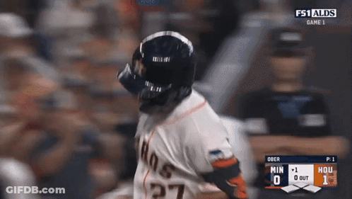 A Baseball Player Wearing A Helmet And Number 27 On His Jersey GIF