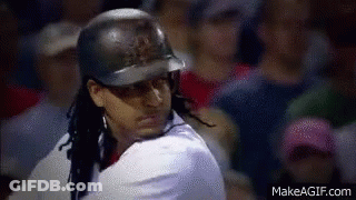 A Baseball Player Wearing A Helmet Is Swinging At A Ball In Front Of A Crowd . GIF