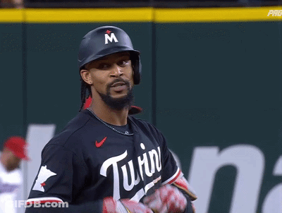 A Baseball Player Wearing A Helmet With A Letter M On It GIF