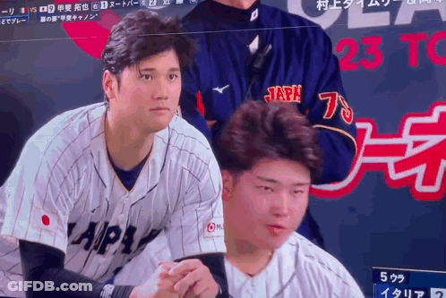 A Baseball Player Wearing A Japan Jersey Stands In Front Of A Screen GIF
