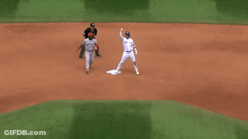 A Baseball Player Wearing A Jersey That Says Angels On It GIF