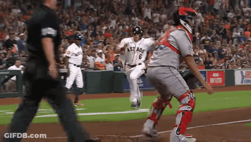 A Baseball Player Wearing A Jersey That Says Astros Is Running Towards The Base GIF
