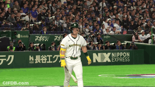 A Baseball Player Wearing A Jersey That Says Australia Holds A Bat GIF