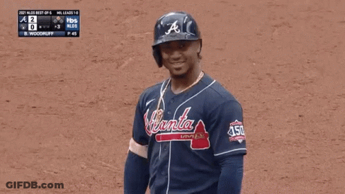 A Baseball Player Wearing A Jersey That Says Braves On It GIF