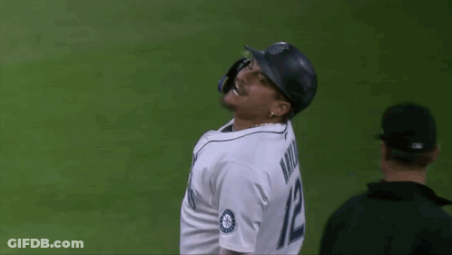 A Baseball Player Wearing A Jersey That Says Mariners On It GIF